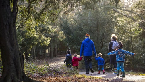 A family on a winter walk at Gibside